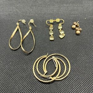 Set of four pairs of gold colored earrings